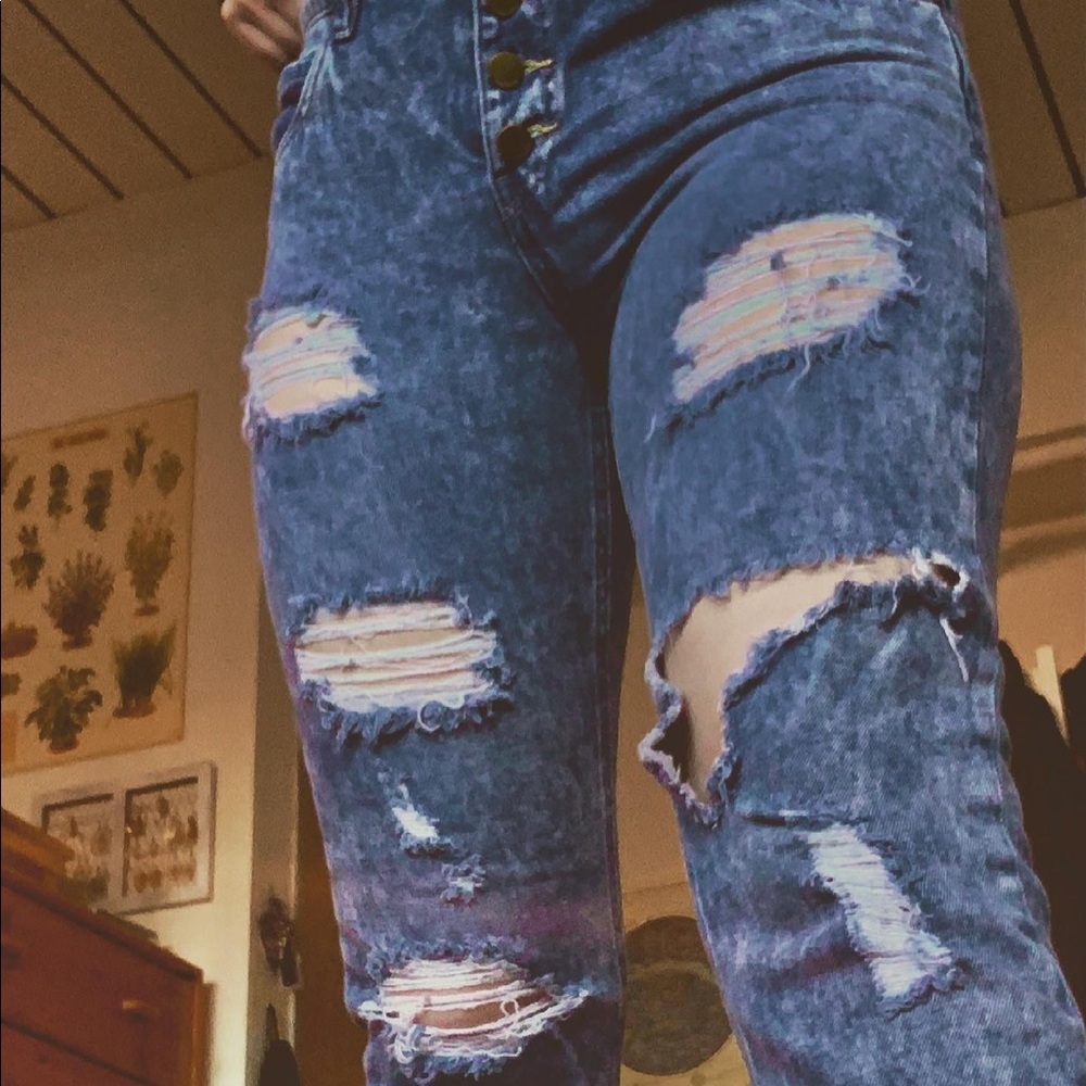 80s style trendy acid wash ripped jeans